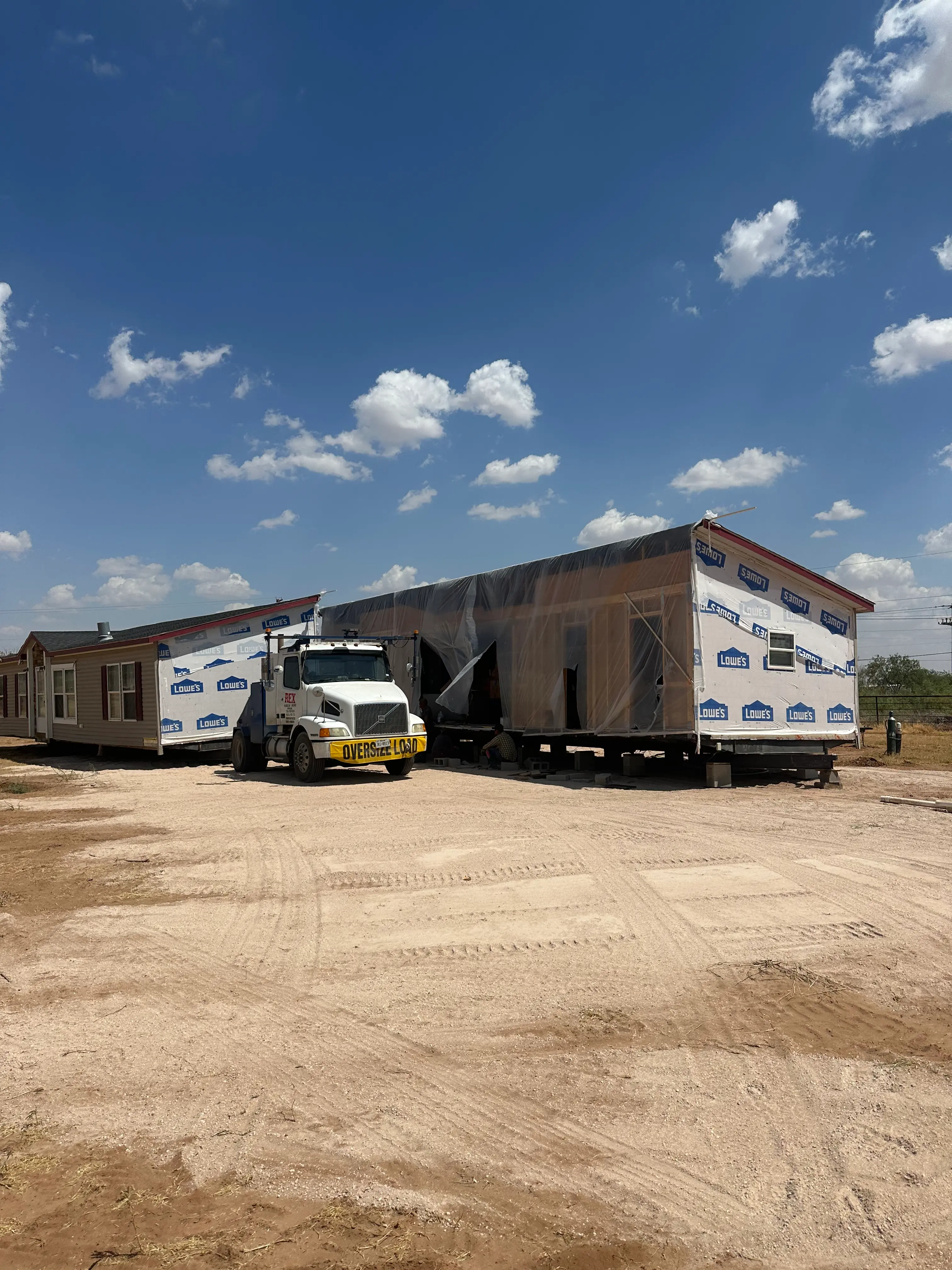 Commercial truck hauling a mobile home