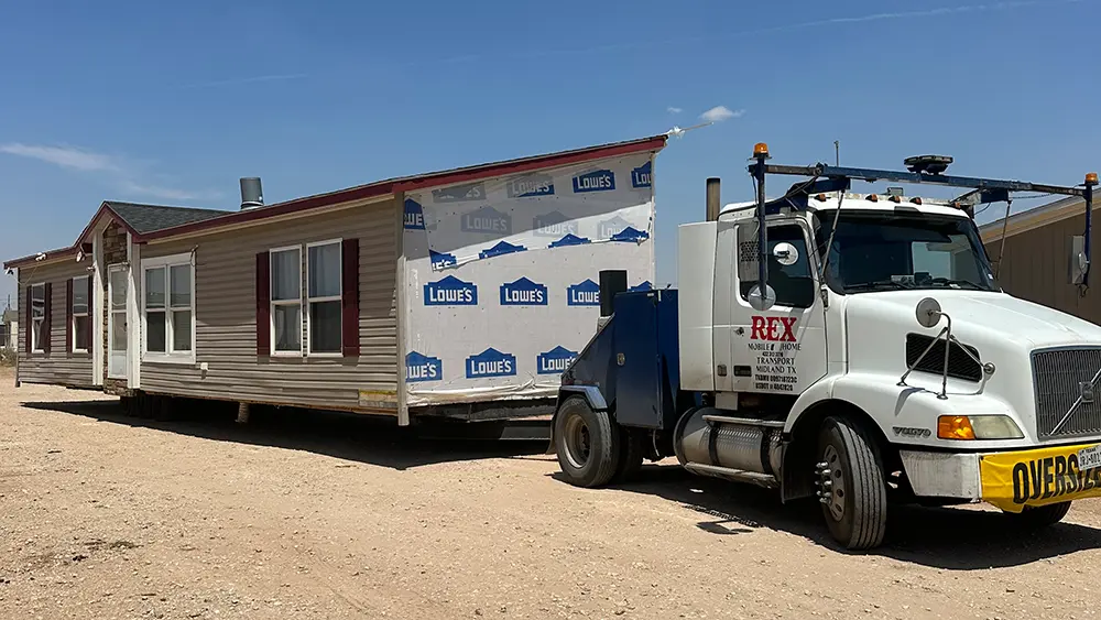 Commercial truck hauling a mobile home